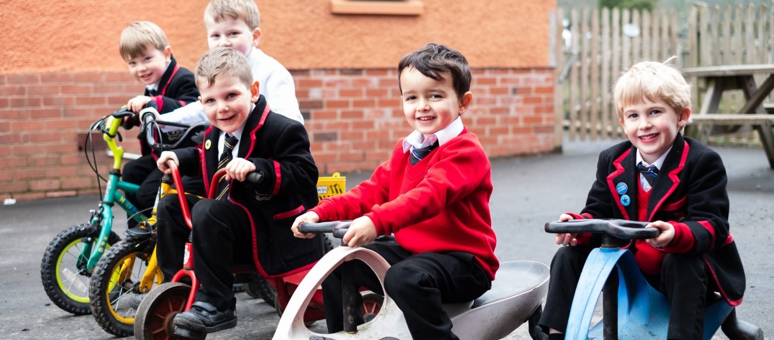 Lucton School children on bikes and trikes in playground