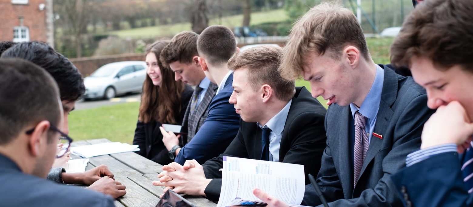 students from a sixth form in lucton working outside