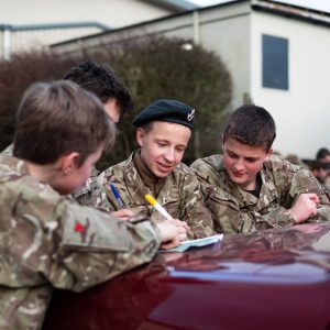 A group of cadets performing an exercise together