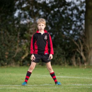 a boy in his PE uniform