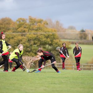 girls playing lacrosse at a middle school in lucton