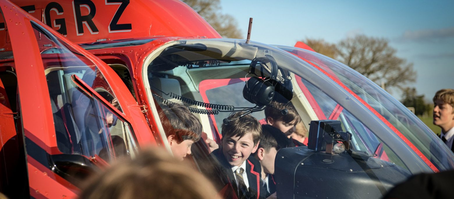 Children enter the helicopter