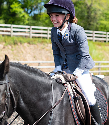 child from a prep school in lucton on a horse