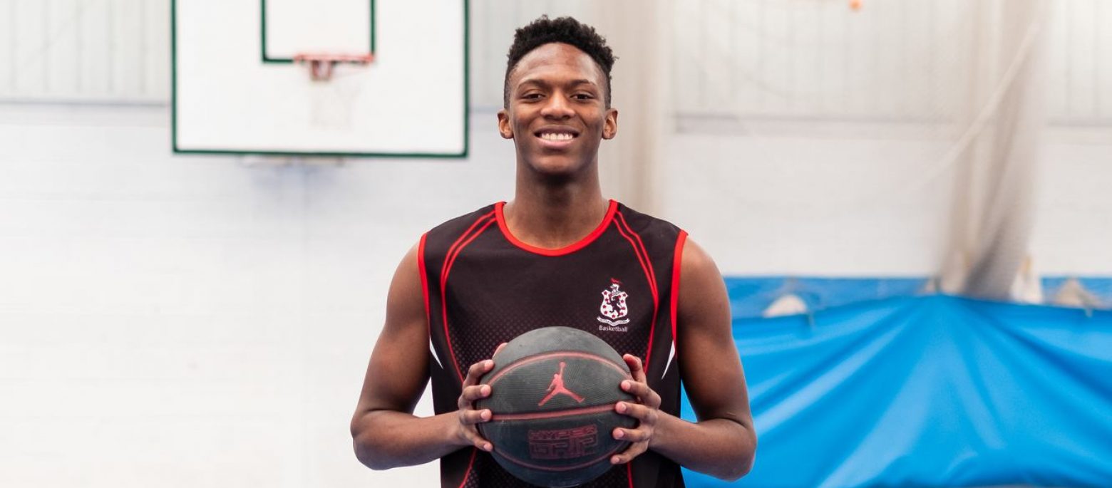 Student holding basketball