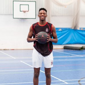 Student holding basketball