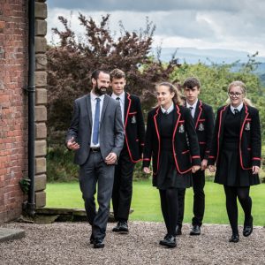 pupils walking with a teacher