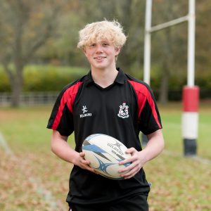 boy from a boarding school in wales with a rugby ball