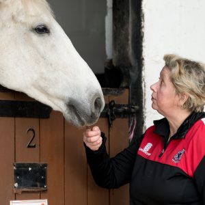 Woman talking to a horse