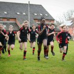 students running across the field