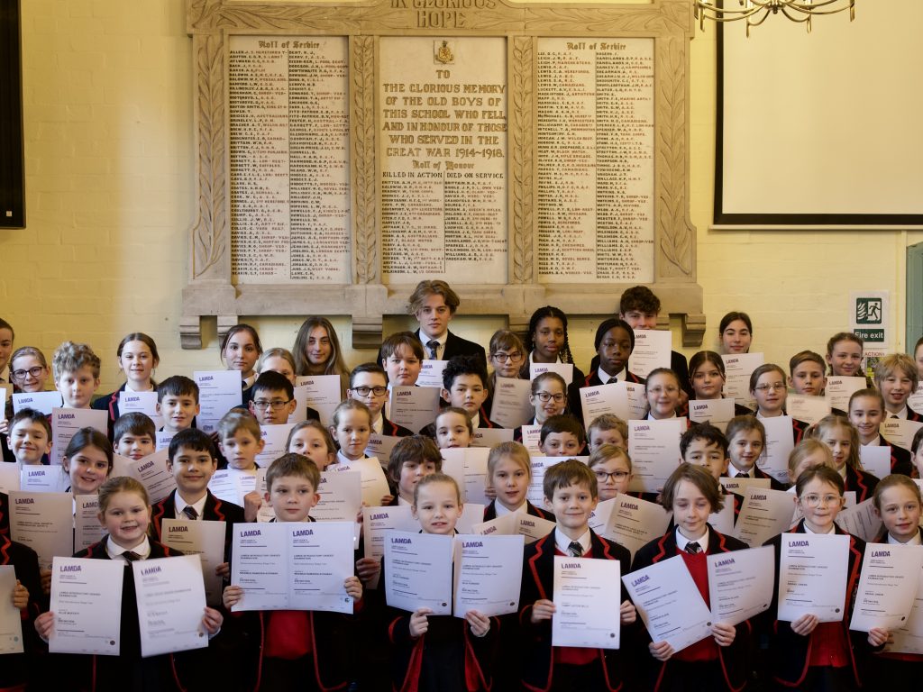 Students holding up LAMDA results