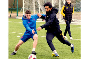Lucton International Football Academy player training under professional coaching supervision