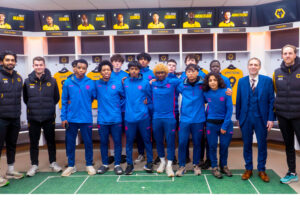Lucton International Football Academy players inside Wolverhampton Wanderers professional dressing room