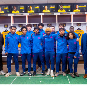 Lucton International Football Academy players inside Wolverhampton Wanderers professional dressing room